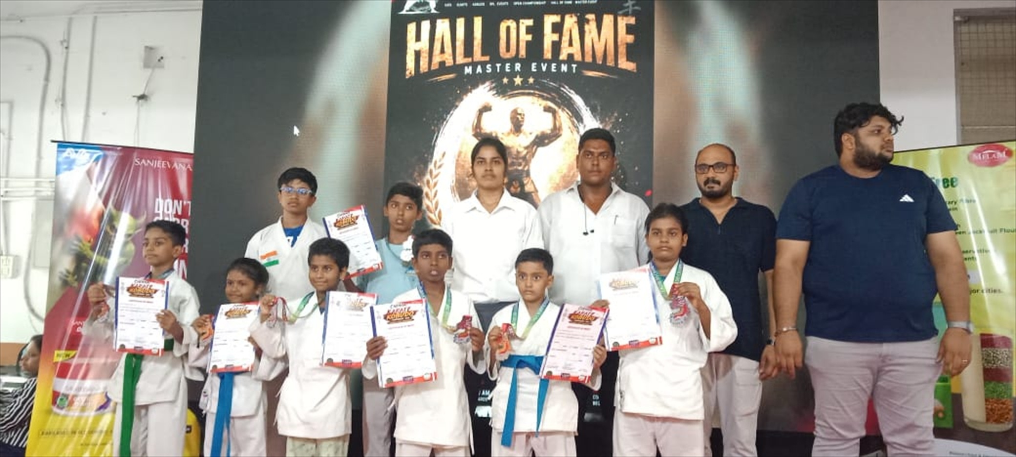 Darkan karate team displaying national tournament certificates and medals at the Hall of Fame event