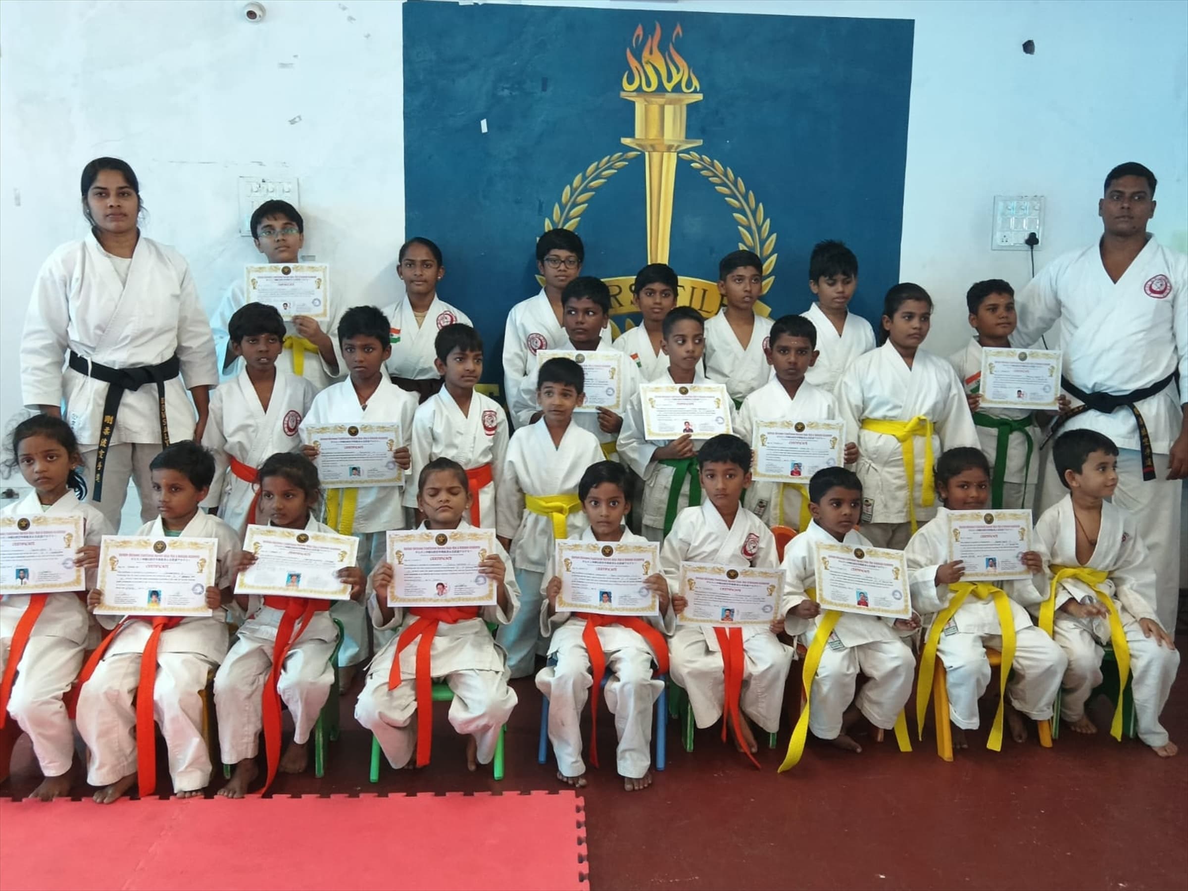 Darkan students and instructors together after a karate belt grading in Tamil Nadu